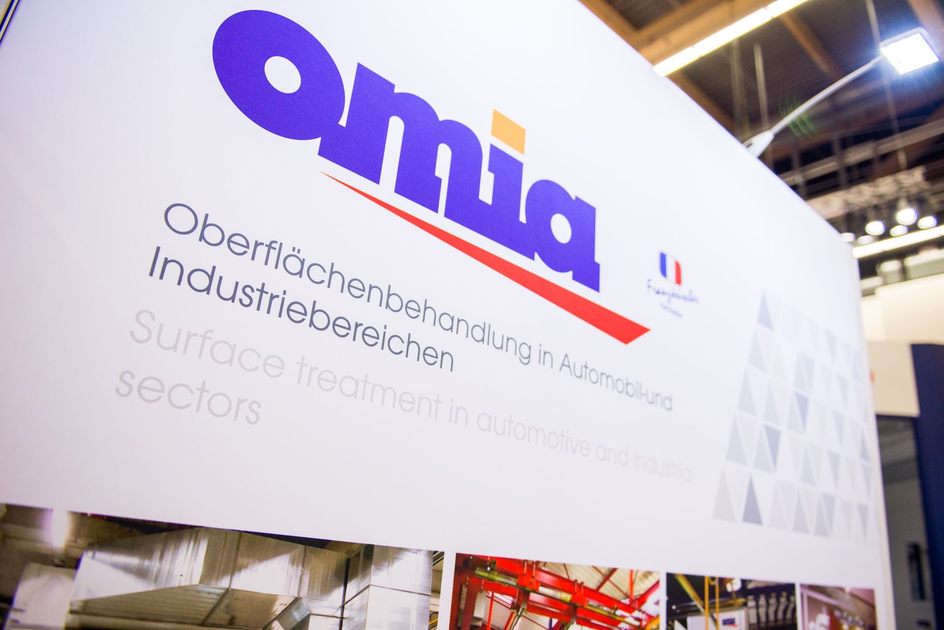 OMIA logo at trade show booth