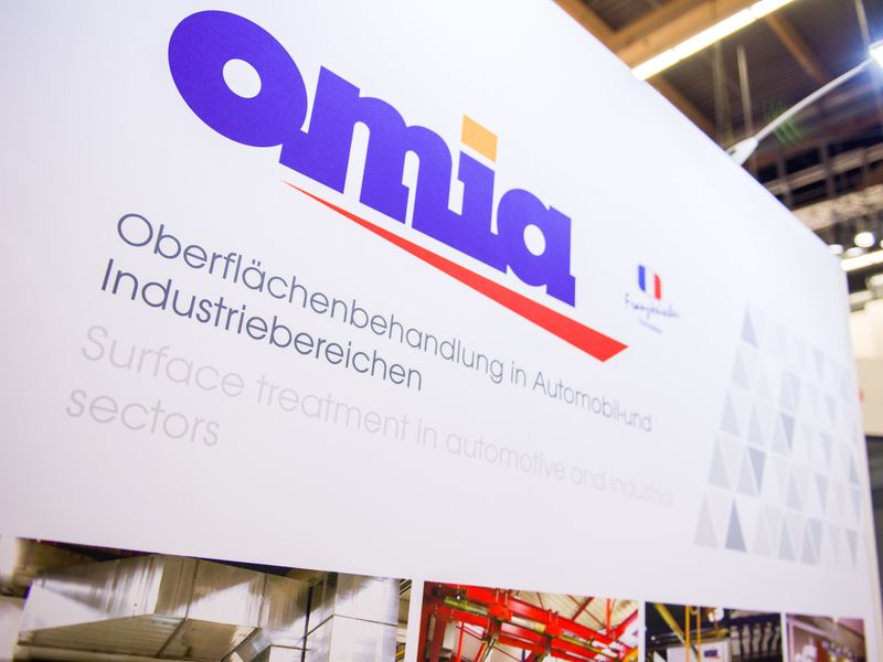 OMIA logo at trade show booth